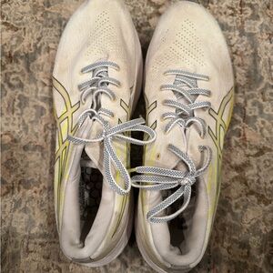White and Yellow ASICS running shoes